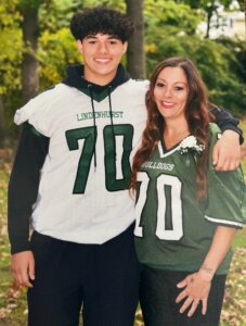 A young man and woman in football jerseys
